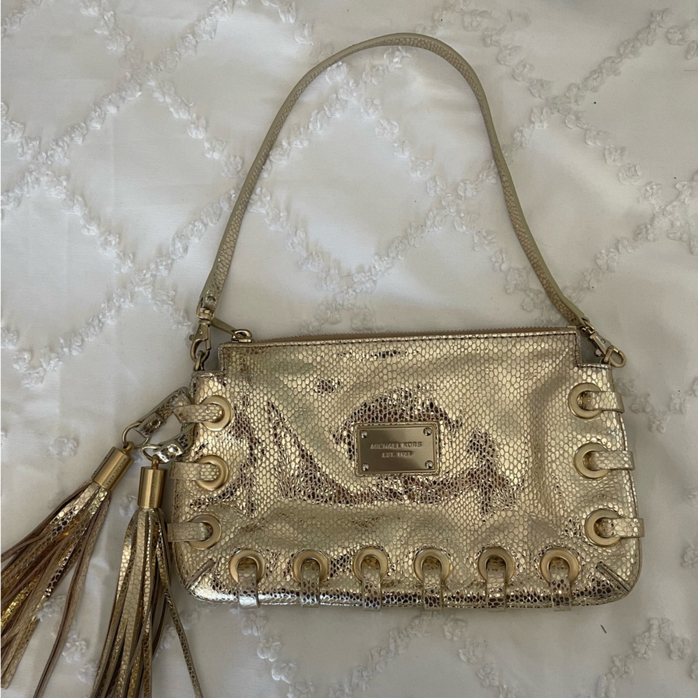 Gorgeous Michael Kors gold mini bag in snake skin type leather.